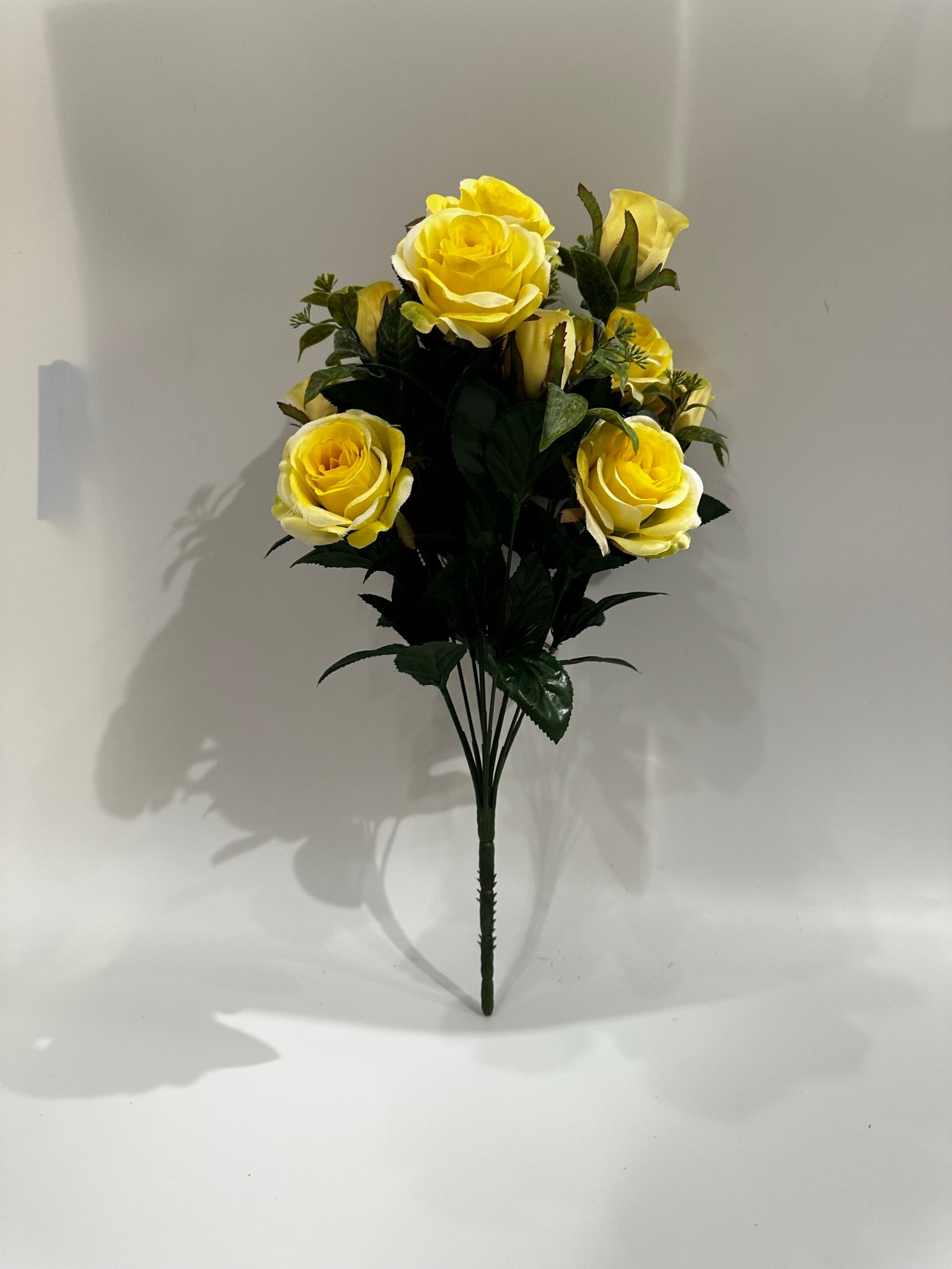 Decorate your home with this rosebush. Place it in a vase to display on your coffee table or fireplace mantel for a lovely touch.RoseYellowDull Satin17" (43.18 cm)12 stems pe